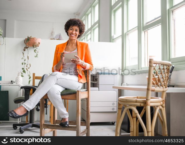 Portrait of young businesswoman in office. Portrait of young businesswoman