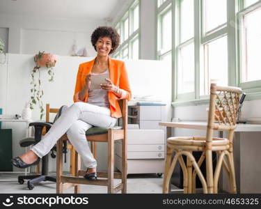 Portrait of young businesswoman in office. Portrait of young businesswoman