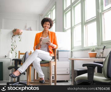 Portrait of young businesswoman in office. Portrait of young businesswoman