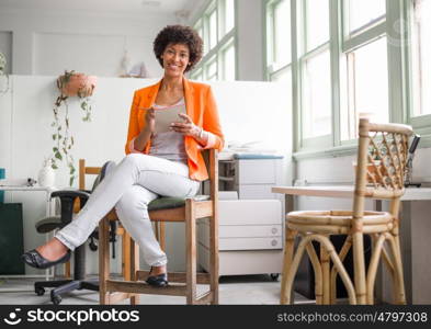 Portrait of young businesswoman in office. Portrait of young businesswoman