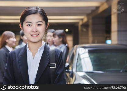 Portrait of Young businesswoman in parking garage