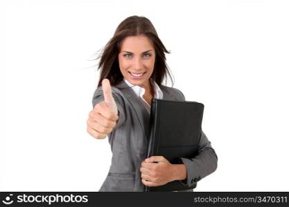 Portrait of young businesswoman showing thumb up