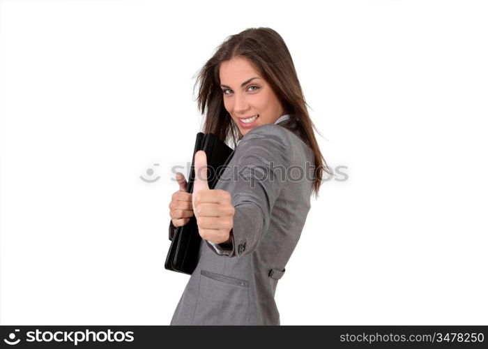 Portrait of young businesswoman showing thumb up