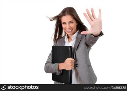 Portrait of young businesswoman showing thumb up