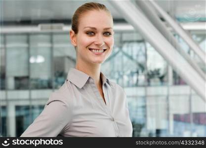 Portrait of young businesswoman, smiling