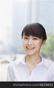 Portrait of young businesswoman smiling, Beijing