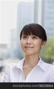 Portrait of young businesswoman smiling, Beijing