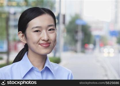 Portrait of young businesswoman smiling in Beijing