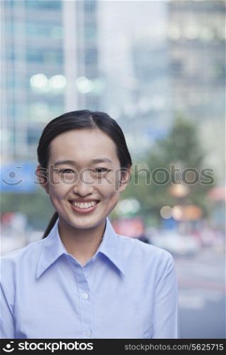 Portrait of young businesswoman smiling in Beijing