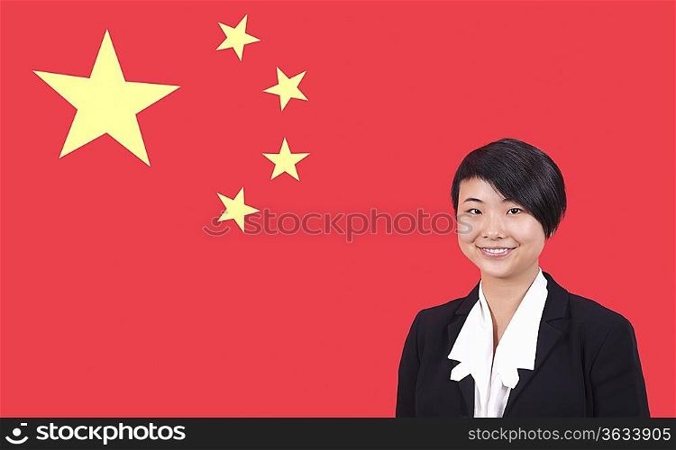Portrait of young businesswoman smiling over Chinese flag