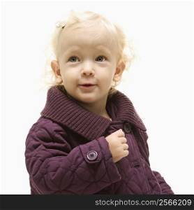 Portrait of young Caucasian female toddler wearing a purple coat.