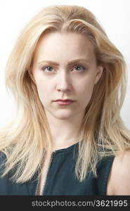 Portrait of young Caucasian woman against white background