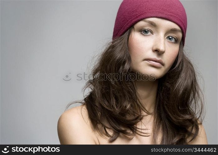 portrait of young confident brunette, studio shot
