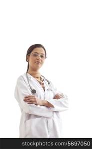 Portrait of young confident female doctor standing against white background