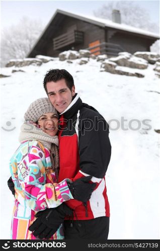 portrait of young couple at ski resort