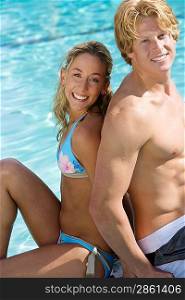 Portrait of Young Couple by Swimming Pool