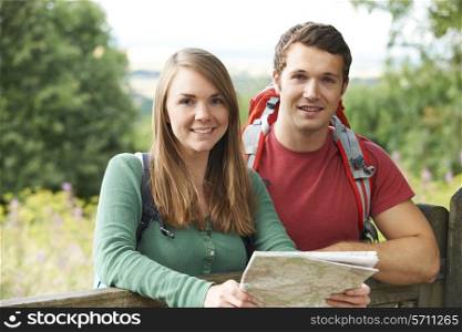 Portrait Of Young Couple Hiking In The Countryside