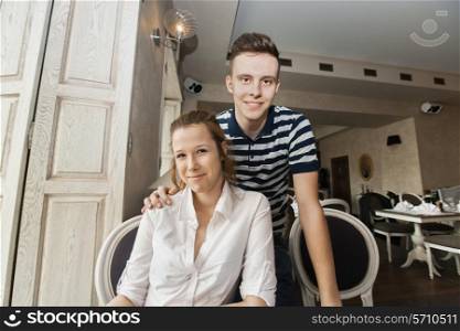Portrait of young couple in restaurant