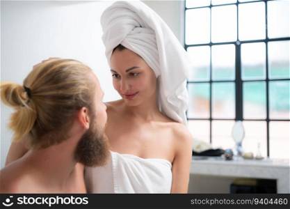 Portrait of young couple in spa salon. Man and woman after shower.