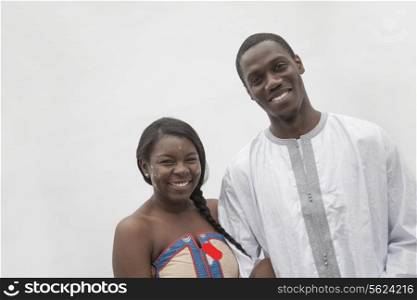 Portrait of young couple in traditional African clothing, studio shot