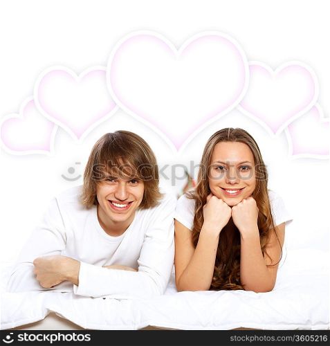 Portrait of young couple in white with heart symbols