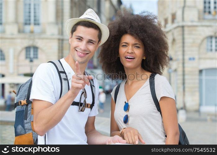 portrait of young couple on city break