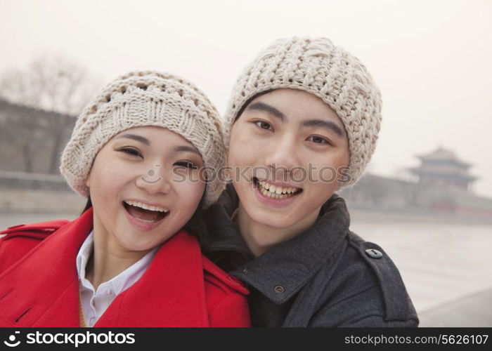 Portrait of young couple outdoors in wintertime, Beijing