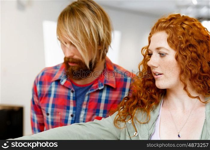 Portrait of young couple. Portrait of young couple in casual wear indoors