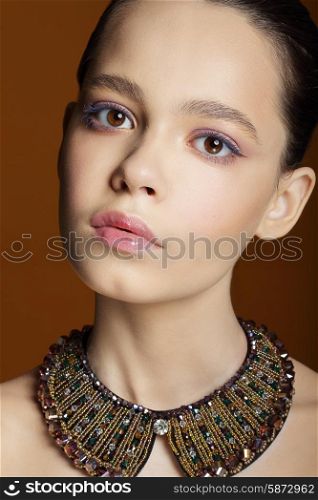 Portrait of Young Cute Woman with Necklace
