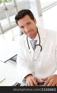 Portrait of young doctor at work