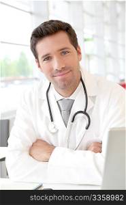 Portrait of young doctor at work