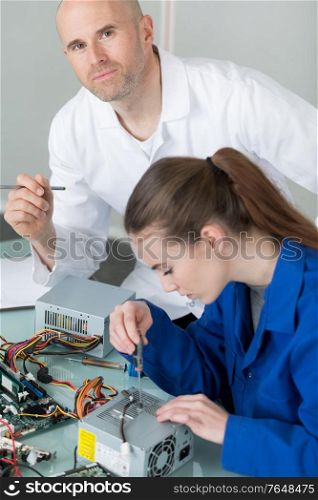 portrait of young electronic technician