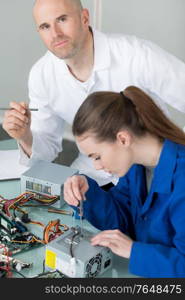 portrait of young electronic technician