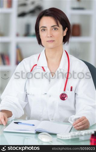 portrait of young female doctor in her office