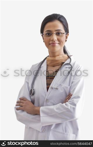 Portrait of young female doctor with stethoscope around neck isolated over white background