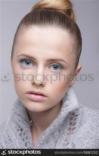 Portrait of Young Female in Grey Woolen Sweater