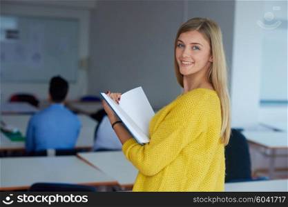 portrait of young female student at school classroom