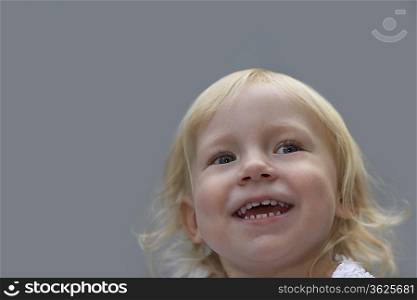 Portrait of young girl (3-4) laughing