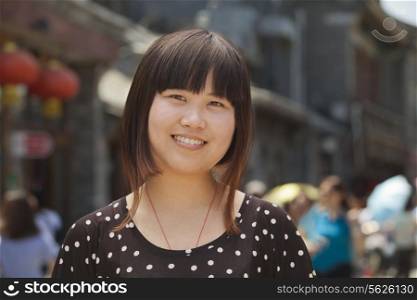 Portrait of young girl in Beijing outdoors