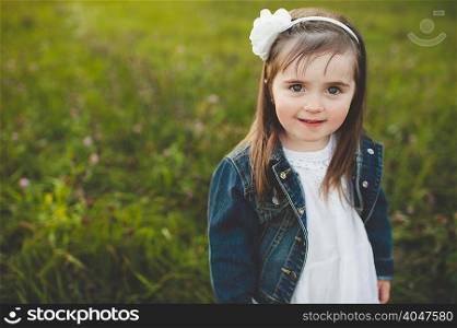 Portrait of young girl in field