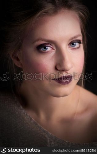 Portrait of young girl on grey background