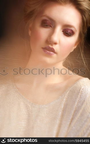 Portrait of young girl on grey background