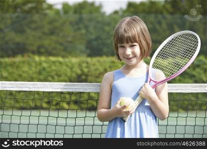 Portrait Of Young Girl Playing Tennis