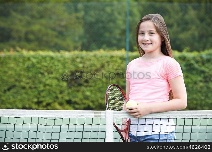Portrait Of Young Girl Playing Tennis