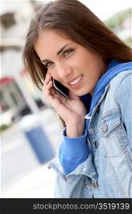 Portrait of young girl using smartphone