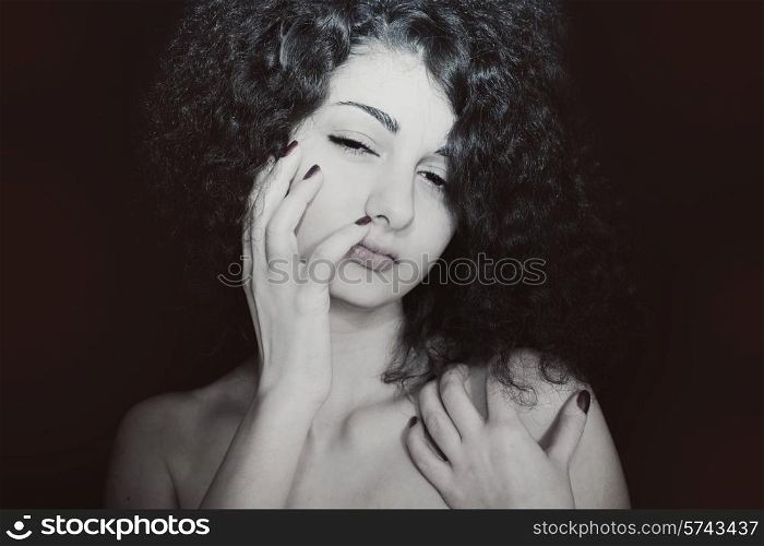 Portrait of young girl with curly hair closeup