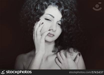 Portrait of young girl with curly hair closeup