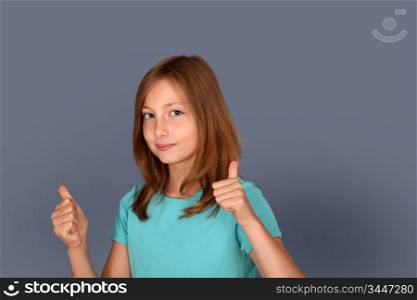Portrait of young girl with thumbs up