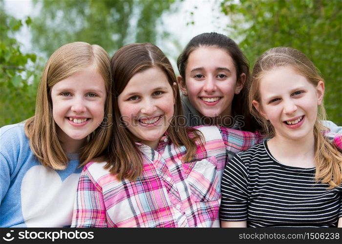 Portrait Of Young Girls Having Fun In Park Together