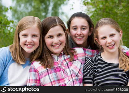 Portrait Of Young Girls Having Fun In Park Together